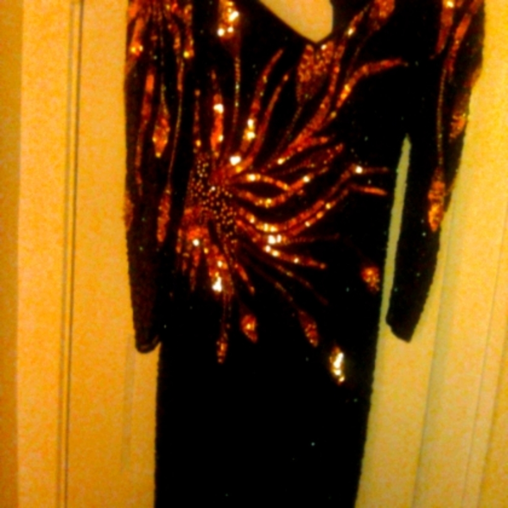 A beautiful gold sequence Black tie dress.
